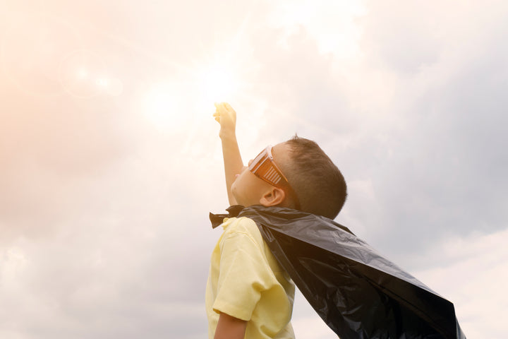 Andy Andrews, happy kid play superhero , boy power concept